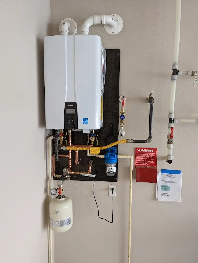 Professional plumber installing copper piping in a South Venice home